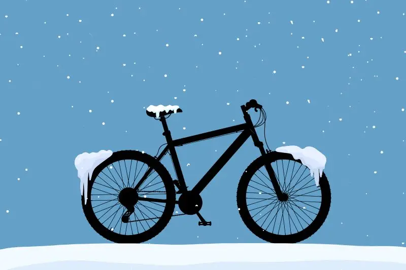 Illustration med en snötäckt cykel.